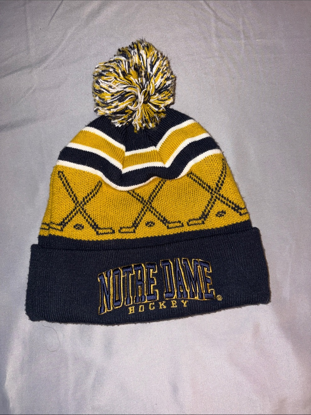 New Era Kids Notre Dame Gold and Navy Pom Beanie